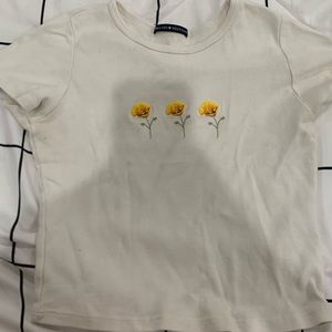 Brandy Melville, baby T, has flowers on it, one size